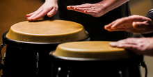 Drum. Hands Of A Musician Playing On Bongs. The Musician Plays The Bongo. Close Up Of Musician Hand Playing Bongos Drums. Afro Cuba, Rum, Drummer, Fingers, Hand, Hit