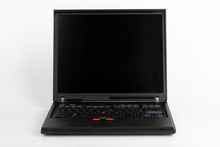 Old Laptop On White Background, Which Was Produced In 2005, Outer Cover Reinforced Titanium, Metal Hinges, Red Trackpoint.