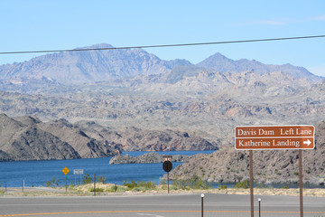 Wall Mural - Davis Dam Sign and a Katherine Landing Sign over the border of Arizona and Nevada on Mohave Lake. Lake Mead National Recreation Area, Mohave County, Arizona USA