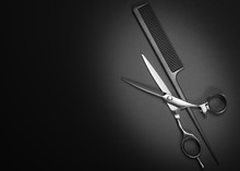 Scissors And Comb. Beauty Salon Equipment. Shears For Haircut On Black Background. Copy Space, Flat Lay View