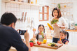 © Nattakorn - Asian family enjoy playing and cooking food in kitchen at home