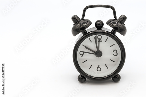 Cuadros en Lienzo A black retro alarm clock isolated on white background