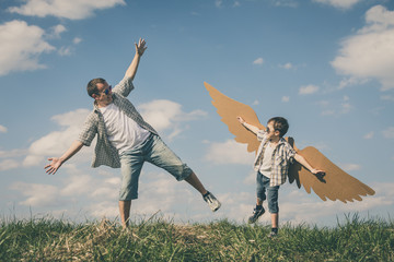 Sticker - Father and son playing with cardboard toy wings