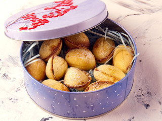 Cookies Nuts with condensed milk and nuts in a tin box. Homemade cookies.