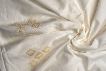 crumpled beige duvet cover embroidered in the style of Richelieu