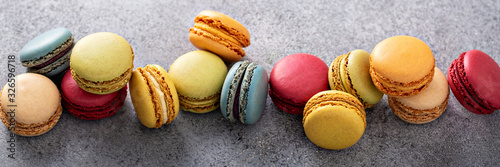 Cuadros en Lienzo Variety of colorful macarons on the table, french dessert