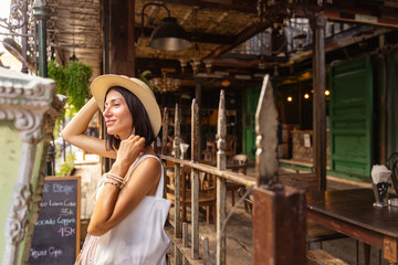 Wall Mural - Happy woman near asian cafe stock photo