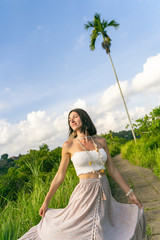 Wall Mural - Joyful woman enjoying tour to exotic country stock photo