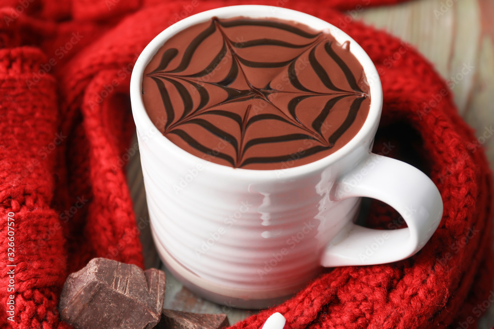 Cup of hot chocolate on table