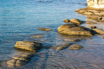 Wall Mural - nature calm background scenic view stone rocky shore line and peaceful reservoir water surface