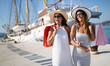 Luxurious life for two women walking and shopping on vacation