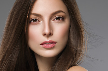 Beautiful female face healthy natural skin fashion make up brunette smooth hair woman spa cosmetic portrait