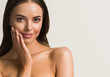 © Utkamandarinka - Beautiful woman hand touching skin manicure nails tanned skin natural make up clen fresh body care