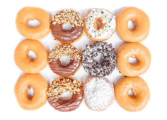 Wall Mural - Donuts arranged on a white background