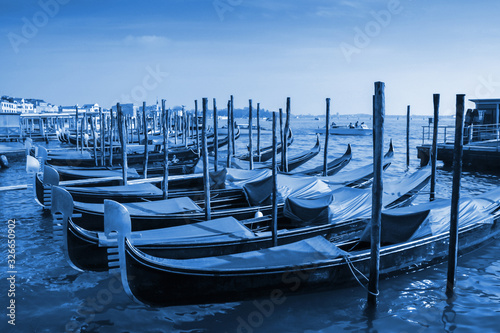 gondolas-moored-in-front-of-saint-mark-square-in-venice-italy-classic-blue-pantone-2020-year-color