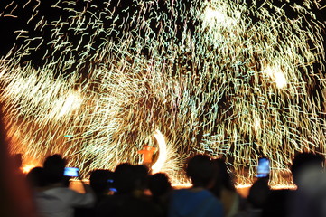 Wall Mural - Fire show performance at a beachfront restaurant in Thailand tourist attraction	