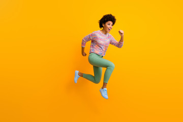 Sticker - Full size profile side photo of cheerful crazy funny afro american girl jump run fast hurry after black friday discount wear stylish green outfit isolated over shine bright color background