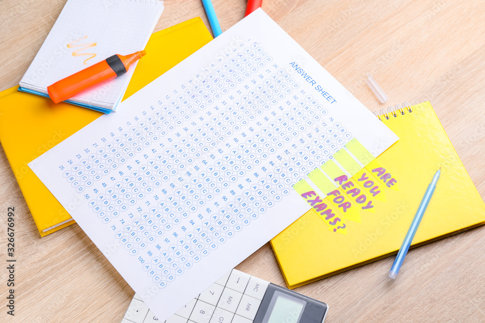 Answer sheet form with stationery on table. Concept of passing exam