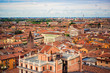 View on roofs of most romantic city of Italy Verona, Veneto. Blue sky above red roofs of medieval city. Spring in italian city. City landscape of italian Verona. Travel tourism destination in Italy