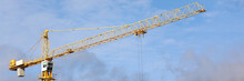Big Hoisting Crane Standing At Blue Sky