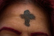Mature woman went to get ash for Lent Day or Ash Wednesday