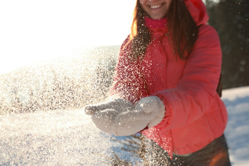 Poster - Young woman having fun outdoors on snowy winter day, closeup