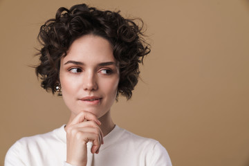 Wall Mural - Image of thinking caucasian woman posing and looking aside