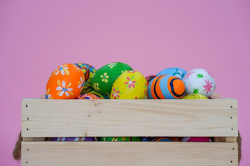 the painted colorful Easter egg on isolated pink background copyspace celebrating the festival christian 