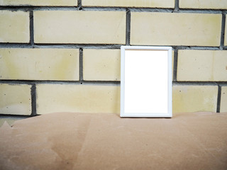 white frame on the background of a brick wall, mockup