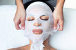 © nenetus - Cosmetologist making the vitamin C facial mask for rejuvenation to woman on the spa center.