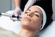 © nenetus - Cosmetologist making mesotherapy injection with dermapen on face for rejuvenation on the spa center.
