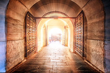 Wall Mural - moscow kremlin gate entrance famous russian architecture landmark interior view against setting sun background. Vintage gate with bridge to ancient fortress. Tourist attraction