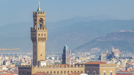 Wall Mural - Palazzo Vecchio timelapse on piazza della Signora in the morning as seen from Piazzale Michelangelo. Florence, Italy.