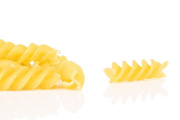 Wall Mural - Lot of whole yellow pasta fusilli isolated on white background