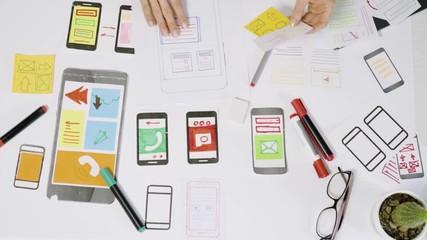 Poster - A team of UX creative designers  web application development for mobile phones. Engineering draw sketch of the user interface. 