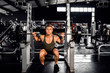© JonoErasmus - Fit young man do barbell squats during a gym workout