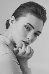 Wall Mural - girl with perfect skin and make-up. fashion portrait of beautiful tender woman in shirt. black and white photo