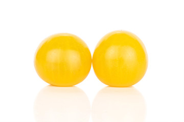 Wall Mural - Group of two whole fresh yellow tomato isolated on white background