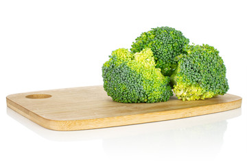 Sticker - Group of three whole fresh green broccoli head on bamboo cutting board isolated on white background