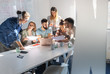 © BalanceFormCreative - A group of programmers congregates in a conference room, engaged in animated discussions, brainstorming ideas, and strategizing to bring their new project to life with precision and innovation.