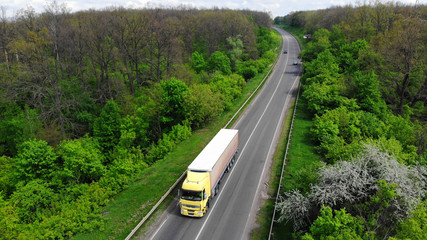 Wall Mural - Truck driving on the highway, aerial. Transport logistics background.