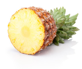 Wall Mural - Half ripe pineapple lying horizontally isolated on white background