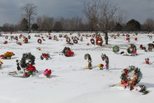 Colorful Christmas Wreaths At At Suburban Chicago Cemetery With Snow