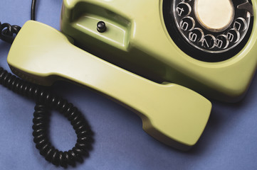 Classic phone with handset. vintage green telephone with phone receiver. office background. old communication technology