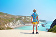 © glimpseofsweden - Boy enjoys the landmark of Jurrasic Coast in Dorset, England. Tuquoise sea when it is as most beautiful in England. Cold water meet varm makes this color of water.