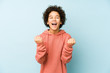 © Asier - African american little boy isolated cheering carefree and excited. Victory concept.