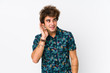 © Asier - Young caucasian man wearing a flower t-shirt isolated trying to listening a gossip.