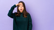 © Asier - Young mixed race hispanic woman isolated shouts loud, keeps eyes opened and hands tense.