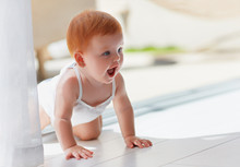 Cute Little Infant Baby Girl Crawling Around The House At Sunny Day