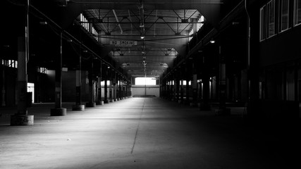 Spooky urban abandoned warehouse floor in black and white background